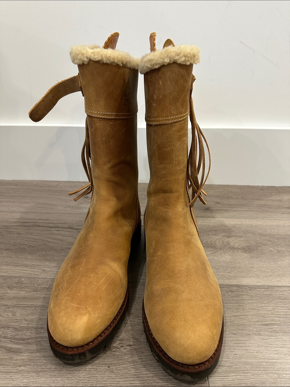 Penelope Chilvers tan suede shearling-trimmed fringe boots